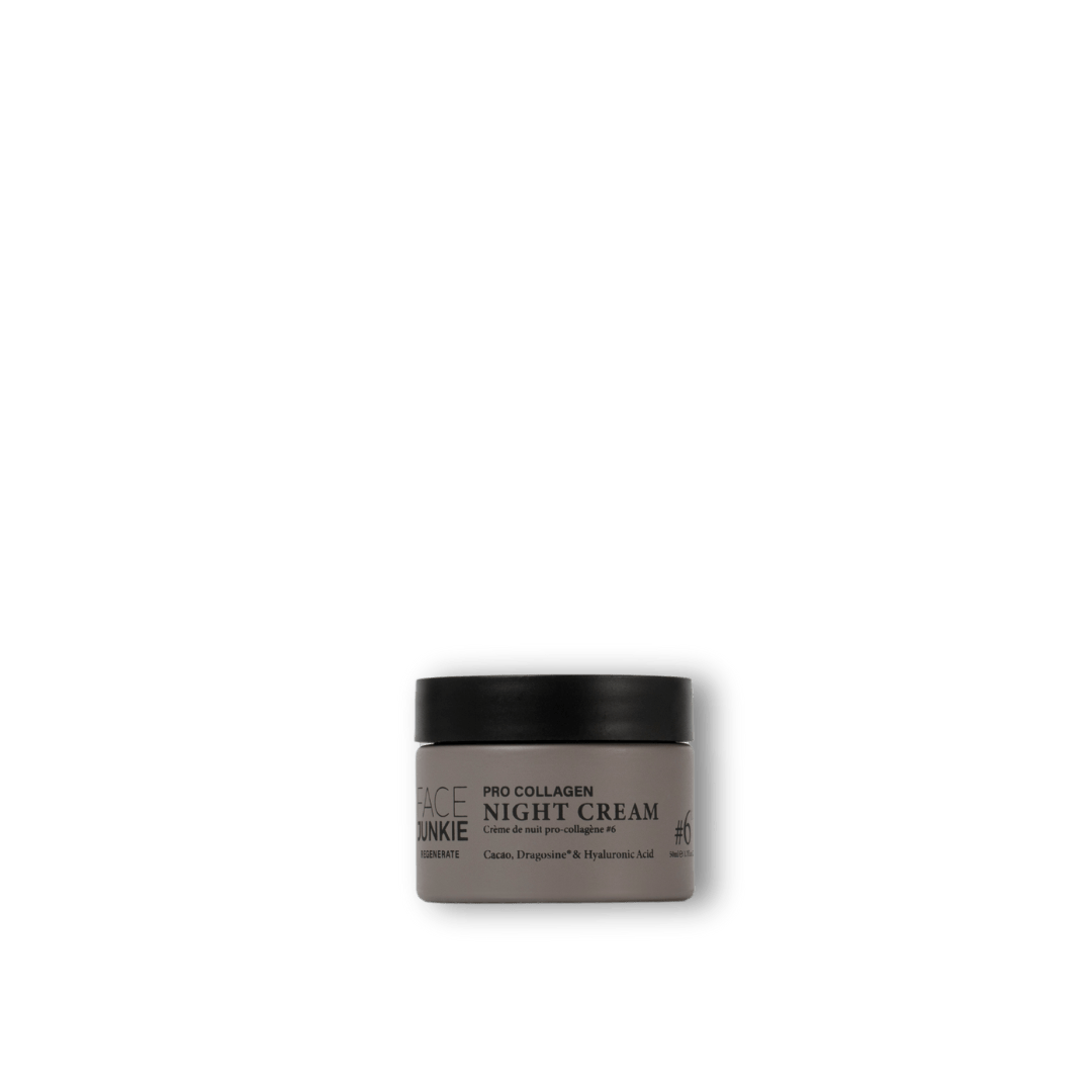 A jar of Face Junkie Pro Collagen Night Cream is displayed against a transparent background. The sleek gray packaging is simple and elegant, with black text highlighting the product’s key ingredients, including cacao, dragosine, and hyaluronic acid. The minimalist design emphasises the product&