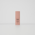 The image displays a single bottle of a skincare product standing upright against a plain white background. The product is labeled "FACE JUNKIE Renewing Eye Cream," and the bottle is a soft pink color with a minimalist design. The text on the bottle mentions that the cream contains beneficial ingredients like Bakuchiol, Rose, and Caffeine, intended for eye care. The packaging is sleek and simple, creating a clean and modern aesthetic.